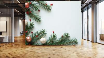 Festive christmas holiday background with pine branches and ornaments for seasonal design Wall mural