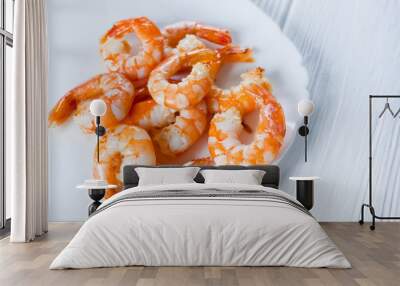 fried shrimps on a white plate on a white wooden table Wall mural