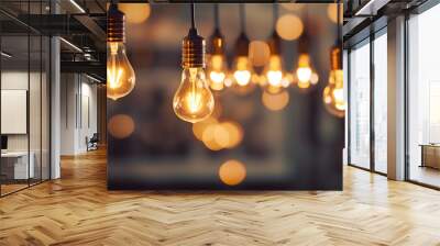 Hanging light bulbs on dark background. Cozy decoration indoor cafe or Christmas party vibe Wall mural