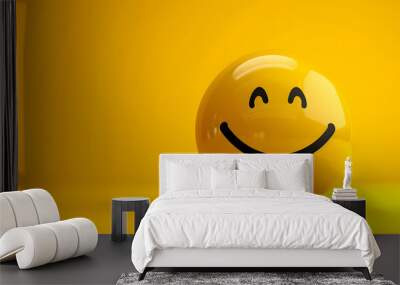 Happy yellow smile emoji isolated on yellow background with copyspace for text Wall mural