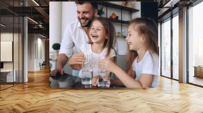 Happy young couple parents teaching little preschool Wall mural