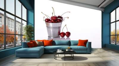 Juicy red fresh cherry berries in a bucket on a white background. Full depth of field. Wall mural