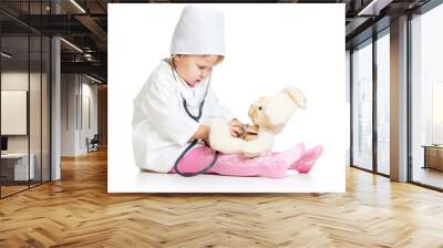 Adorable child with clothes of doctor and hare toy over white Wall mural