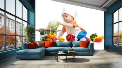 baby chef with healthy  food vegetables and pan Wall mural