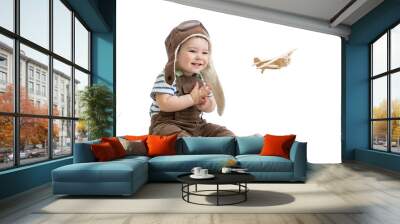 child boy playing with wooden plane Wall mural