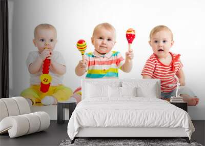 Children babies toddlers playing with musical toys. Isolated on white background Wall mural