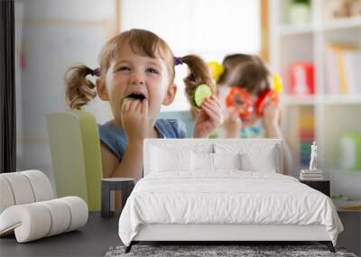 children eating vegetables in kindergarten or at home Wall mural