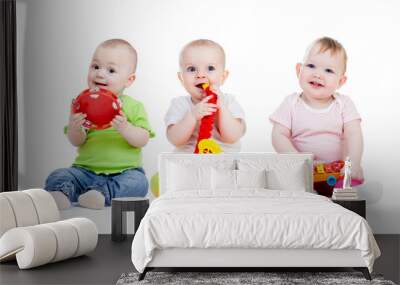 Children playing with musical toys. Isolated on white background Wall mural