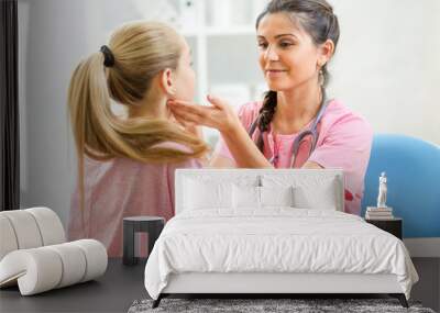 doctor examining teenager patient at office Wall mural