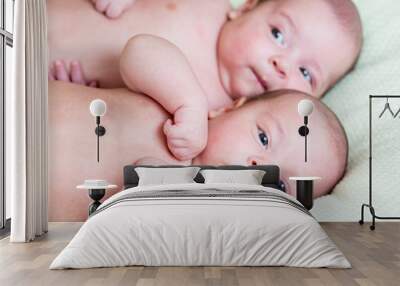 funny newborn baby twins lying one next other Wall mural