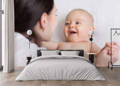 happy infant baby looking at mom Wall mural