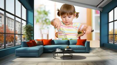 kid eating healthy food at home or kindergarten Wall mural