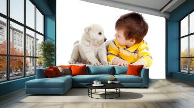 little kid training puppy on white background Wall mural