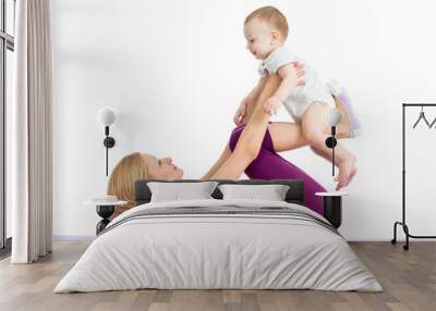 mother with baby doing gymnastics and fitness exercises Wall mural