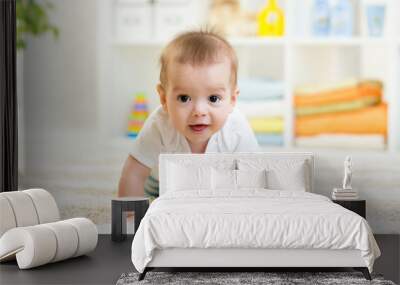 Nursery baby boy crawling on floor indoors at home Wall mural