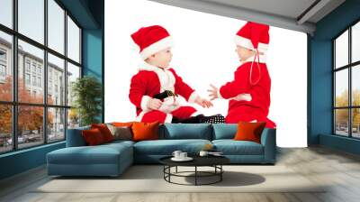 two funny small kids in Santa Claus clothes isolated on white ba Wall mural