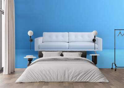 Modern white sofa isolated on blue background Wall mural