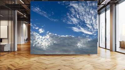 Natural sky background, fantastic cloudscape, blue sky and many small white clouds, heavens Wall mural