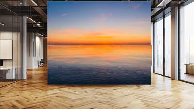 Orange sky after the sunset at the sea, evening sea horizon  Wall mural