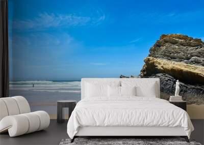 Rocky ocean coast, ocean bay with rocky coast and sand beach, blue sky, no people Wall mural