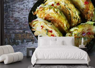 Selective focus. Macro. Grilled cabbage slices with aromatic herbs. Wall mural