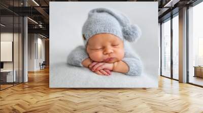 Sleeping newborn boy in the first days of life on white background Wall mural