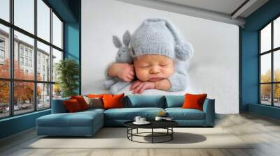 Sleeping newborn boy in the first days of life on white background Wall mural