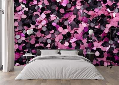 Glittering Pink and Black Confetti. Sparkling pink and black confetti scattered on a dark surface. Wall mural