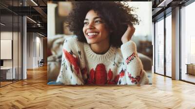 Radiant Young Woman in Cozy Sweater Enjoying Home Comfort Wall mural