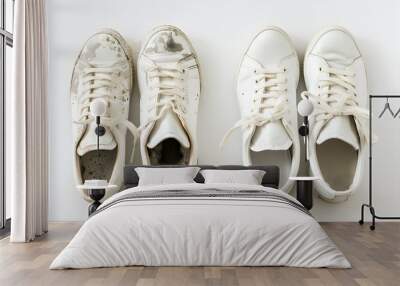 Top view pair of white used old dirty basic sneakers isolated on white background Wall mural