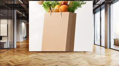 Vegetables and fruits groseries flying out the brown paper bag isolated on white background Wall mural