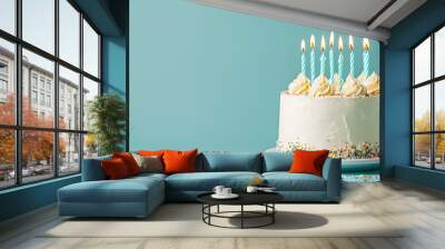 White birthday cake with candles over blue background, copy space for text Wall mural