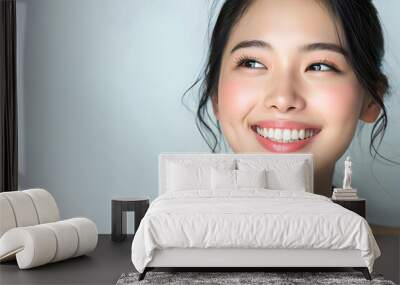 Young Asian woman close up portrait. Model woman laughing and smiling. Healthy face skin care beauty, skincare cosmetics, dental. Wall mural