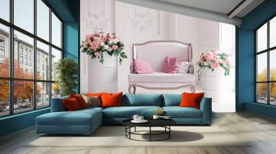 Interior of a snow-white living room with a vintage sofa and flowers Wall mural