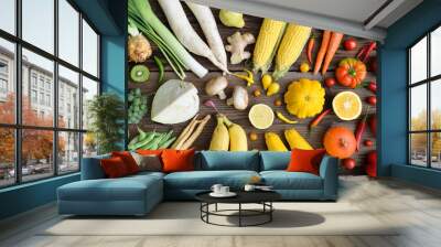 White, yellow, green, orange, red, purple fruits and vegetables on wooden background.  Healthy food. Multicolored raw food. Wall mural