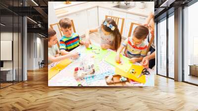 Cute little children attend masterclass on how to do postcards Wall mural