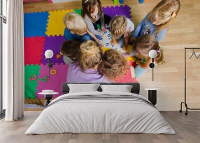 Educational group activity at the kindergarten or daycare Wall mural