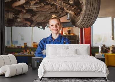 Successful auto mechanic woman at workshop indoor Wall mural