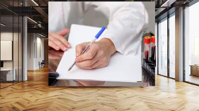 Nurse writes blood diagnosis. Wall mural