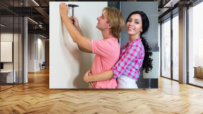 Couple together has small home repairs Wall mural