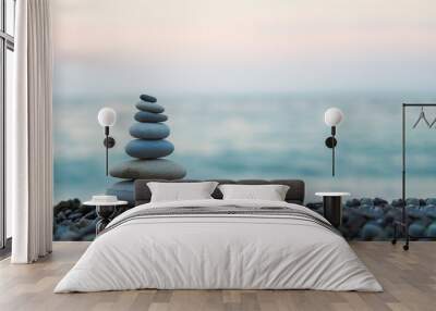 made of stone tower on the beach and blur background Wall mural