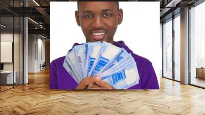 African Nigerian man holding new naira notes smiling happily wearing a purple hoodie pointing finger upwards in direction hand holding Counting new 1000 Nigeria naira note money Wall mural