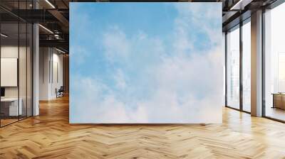 Background of blue sky with white pink clouds at sunset Wall mural