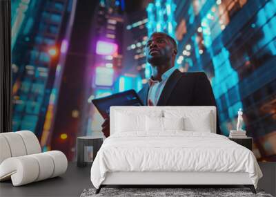 handsome black african american businessman holding smart tablet screen in hands analyzing the world economy stock market. holographic web design. city skyscrapers in blurry background Wall mural