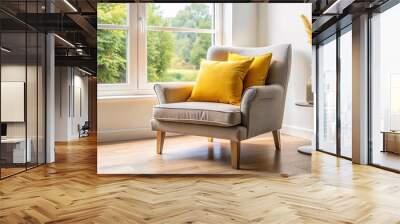 A cozy chair with yellow pillows next to a window in a room Wall mural