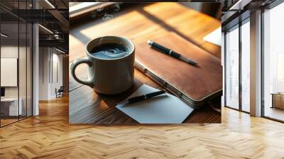 A steaming cup of coffee sits on a wooden table beside a leather-bound journal and two pens, inviting quiet contemplation and creative inspiration. Wall mural