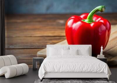 Close-up of a vibrant red bell pepper on a wooden cutting board, fresh, healthy, organic, ingredient, nutrition, cooking Wall mural