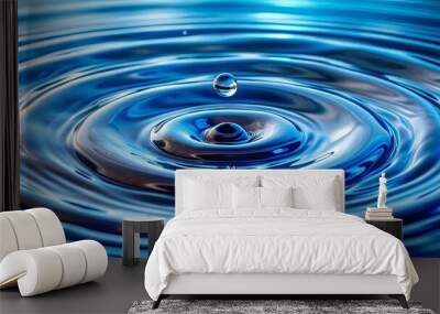 Close-up shot of a swirling blue pattern in calm water with suspended droplets Wall mural