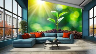 Vibrant image of a young plant growing in lush green surroundings, growth, nature, nurture, environment, plant, foliage Wall mural