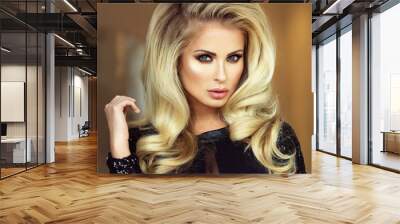 Elegant blonde lady looking at camera. Wall mural